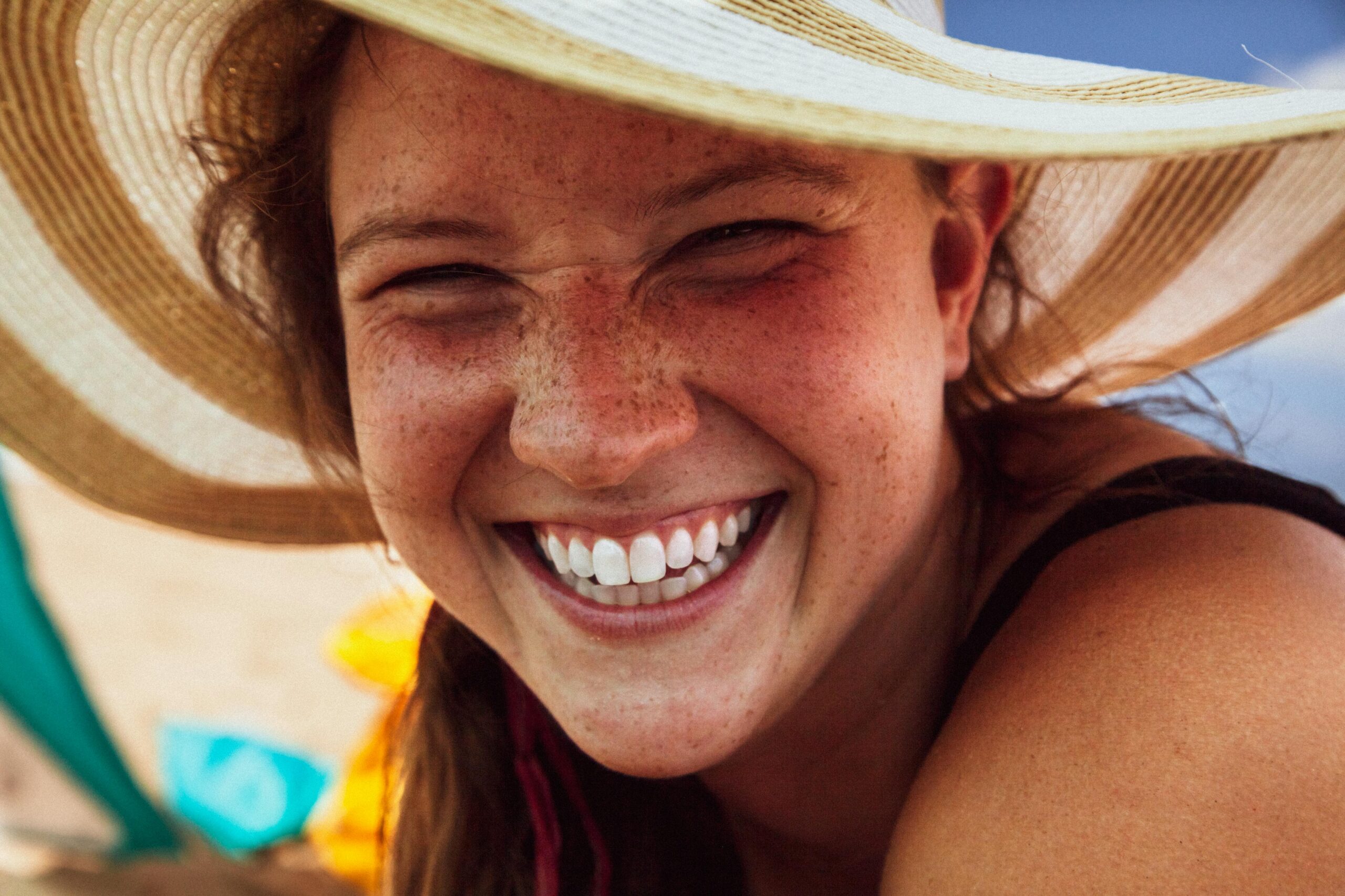 female patient enjoying vacation after Teeth Whitening, Frisco, TX: